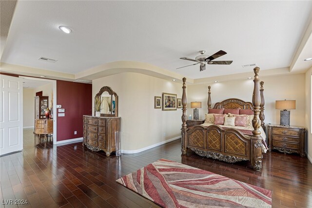 bedroom with dark wood-type flooring and ceiling fan