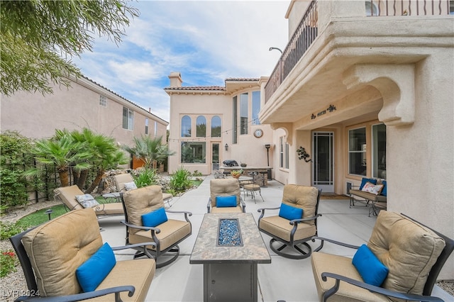 view of patio / terrace featuring a balcony and outdoor lounge area