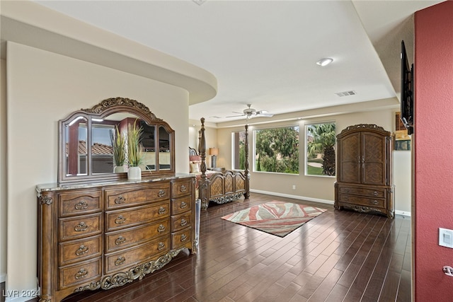 bedroom with dark hardwood / wood-style floors