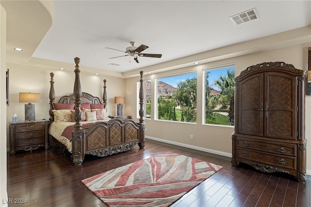 bedroom featuring ceiling fan and dark hardwood / wood-style floors