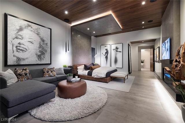 bedroom with wooden ceiling and light hardwood / wood-style flooring