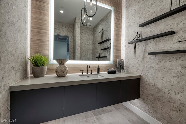 bathroom featuring vanity and an inviting chandelier