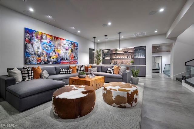 living room with concrete flooring