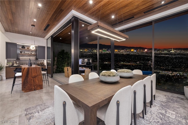 dining space with wooden ceiling