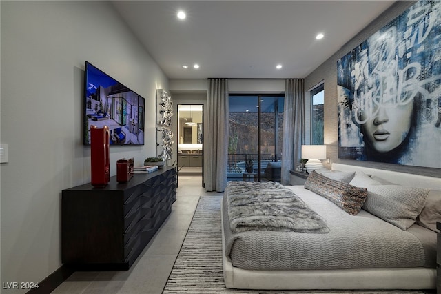 bedroom featuring access to exterior, ensuite bath, and tile patterned floors