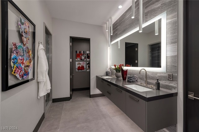 bathroom with tile patterned flooring, vanity, and tasteful backsplash