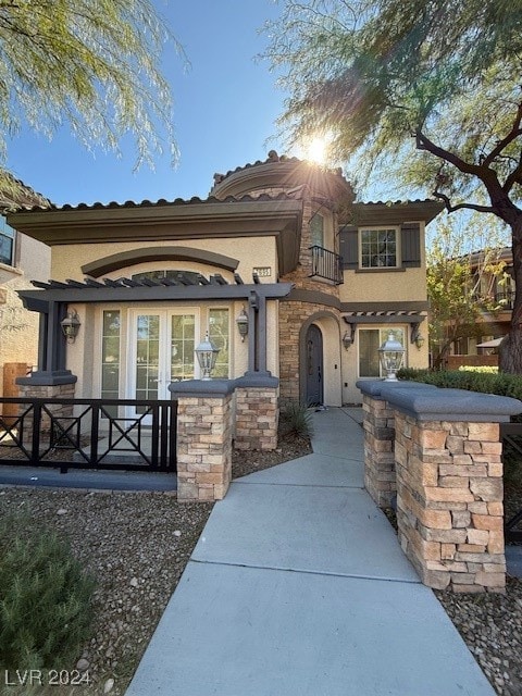 mediterranean / spanish-style home featuring french doors