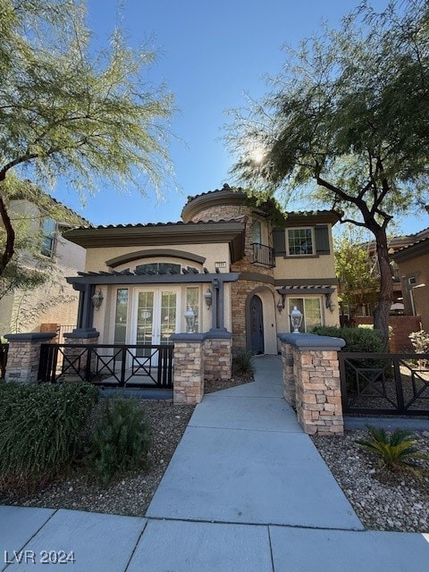 mediterranean / spanish home with french doors