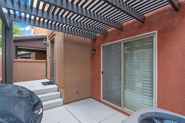 view of patio with central air condition unit, grilling area, and a pergola