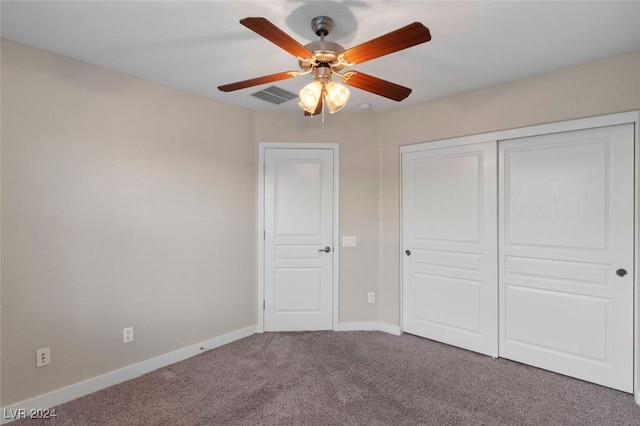 unfurnished bedroom with carpet floors, a closet, visible vents, ceiling fan, and baseboards