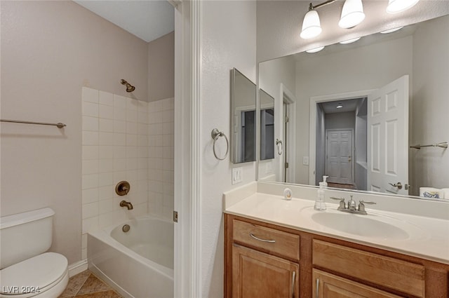 full bathroom with vanity, tile patterned flooring, washtub / shower combination, and toilet