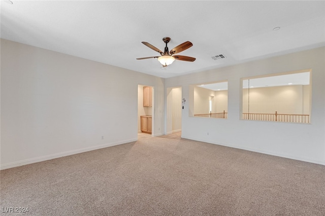 carpeted empty room with ceiling fan