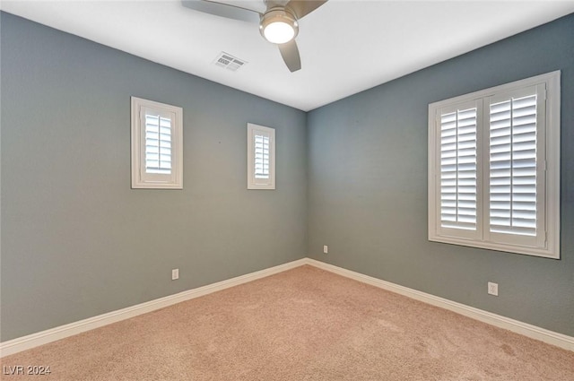 carpeted empty room with ceiling fan