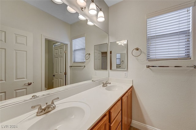 bathroom with vanity and plenty of natural light