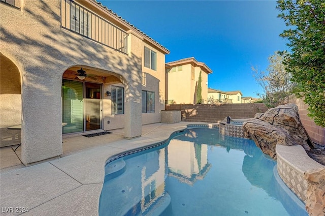 view of pool featuring a patio, an in ground hot tub, and ceiling fan