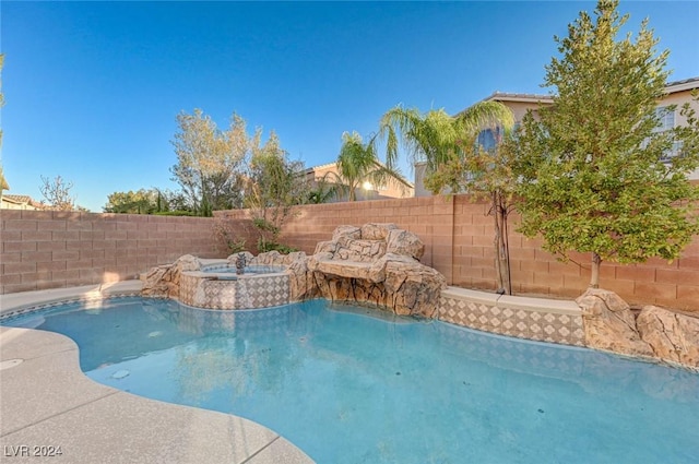 view of pool featuring an in ground hot tub