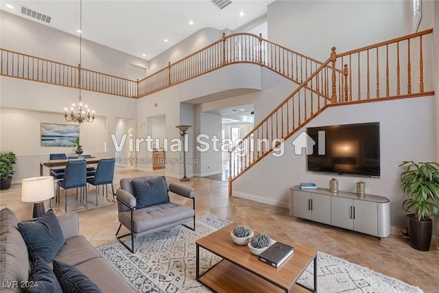 living room featuring a notable chandelier and a towering ceiling