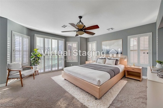 carpeted bedroom featuring ceiling fan and access to outside