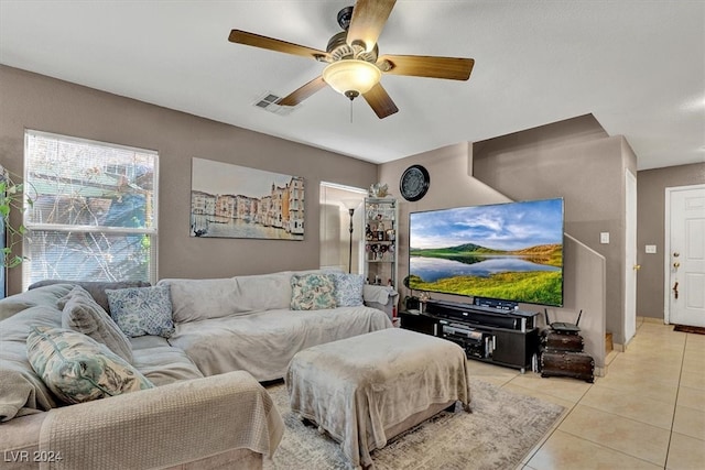 tiled living room featuring ceiling fan