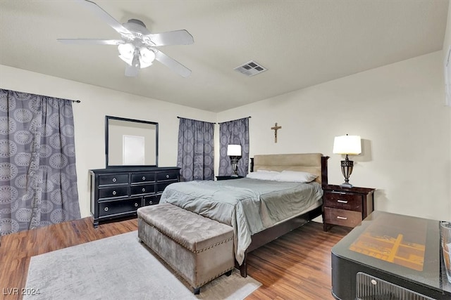 bedroom featuring ceiling fan and dark hardwood / wood-style flooring