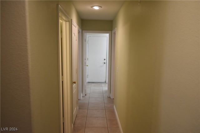 hallway with light tile patterned floors