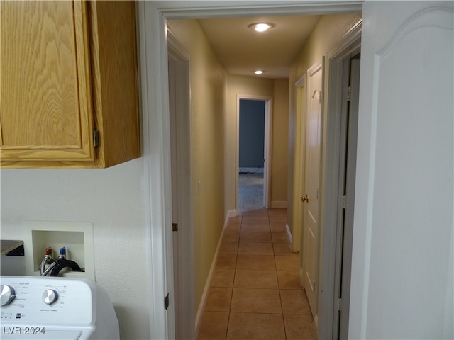 hall with light tile patterned floors and washer / clothes dryer