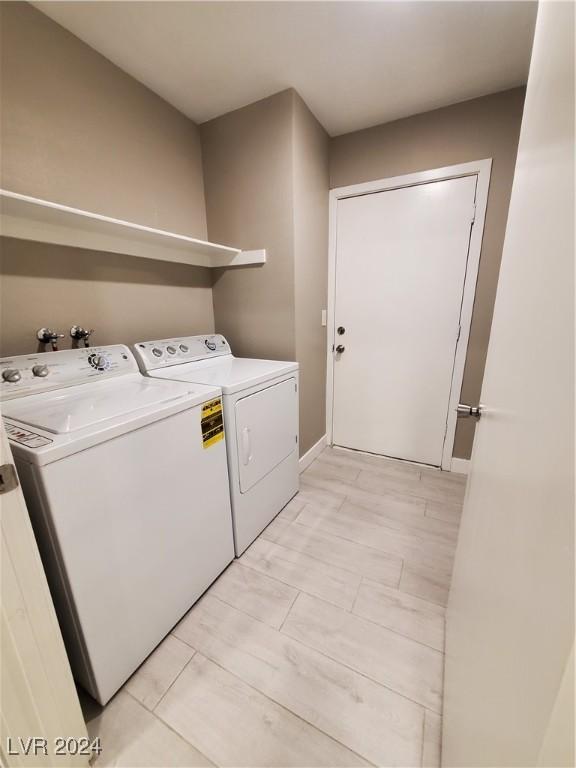 laundry room with washer and dryer