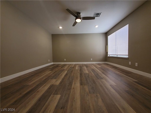 unfurnished room featuring dark hardwood / wood-style flooring and ceiling fan