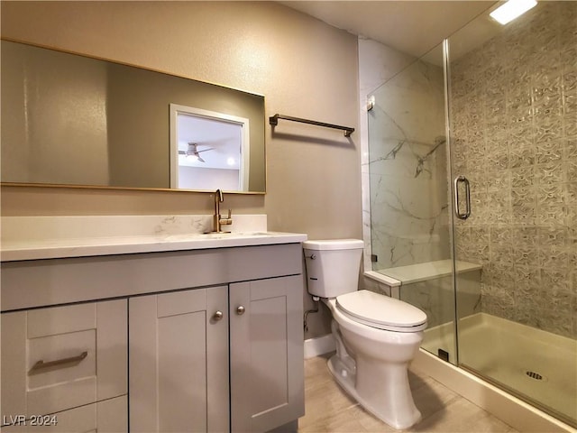 bathroom featuring vanity, toilet, and walk in shower