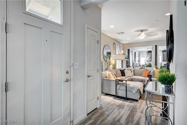 foyer entrance featuring hardwood / wood-style floors and ceiling fan