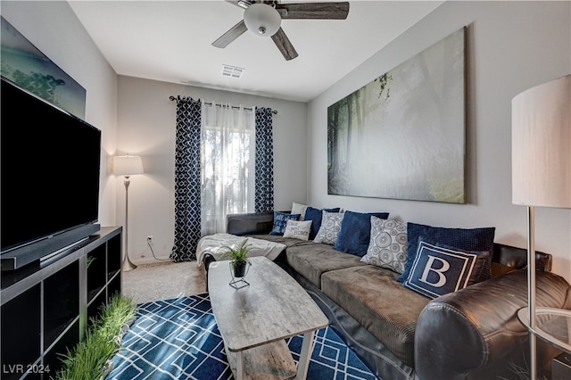 living room featuring ceiling fan and carpet floors