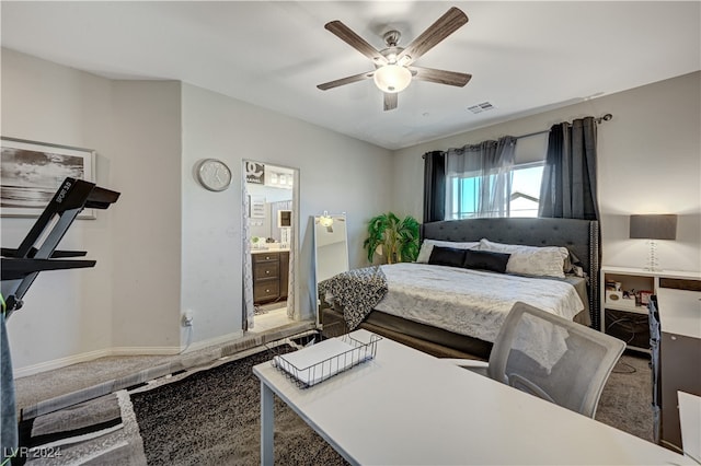 bedroom featuring ceiling fan, connected bathroom, and carpet