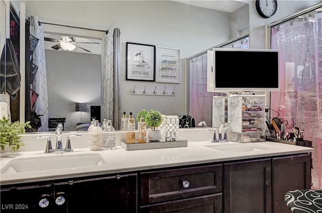 bathroom with ceiling fan and vanity