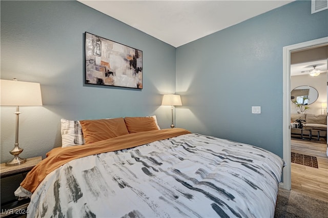 bedroom with wood-type flooring