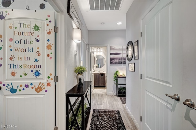 hall featuring light hardwood / wood-style floors