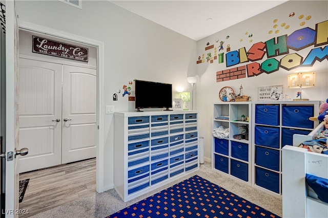 bedroom with wood-type flooring and a closet