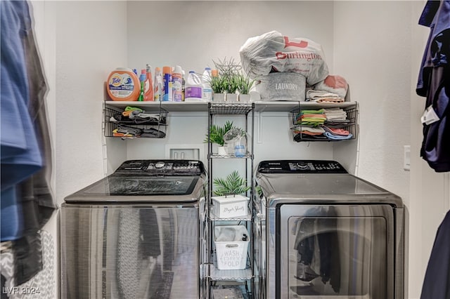 clothes washing area featuring washer and dryer