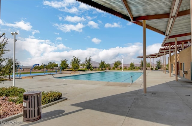 view of swimming pool featuring a patio area