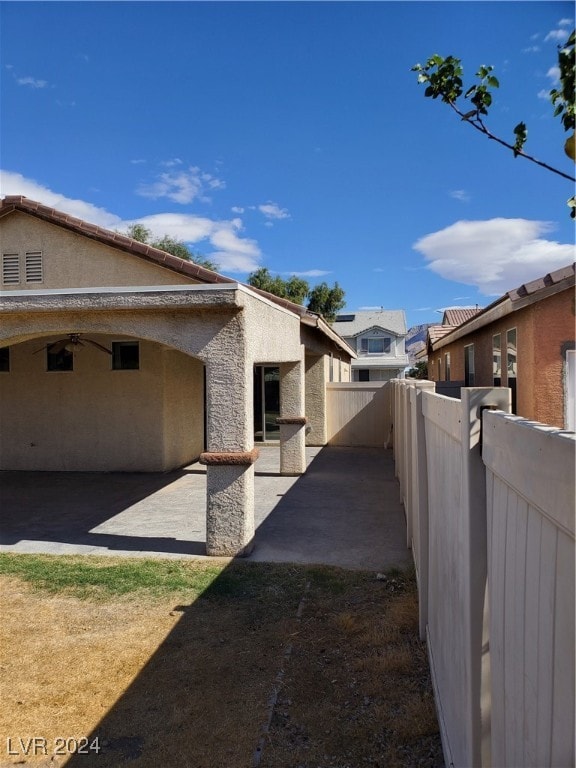 view of side of home featuring a patio