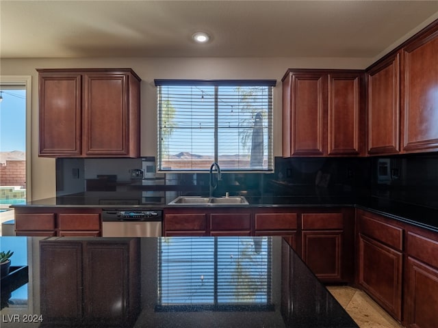 kitchen featuring stainless steel dishwasher, a healthy amount of sunlight, and sink