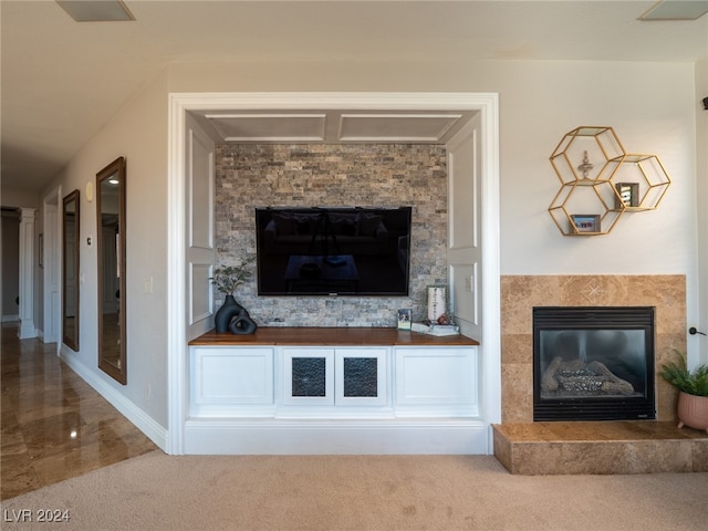 carpeted living room with a fireplace