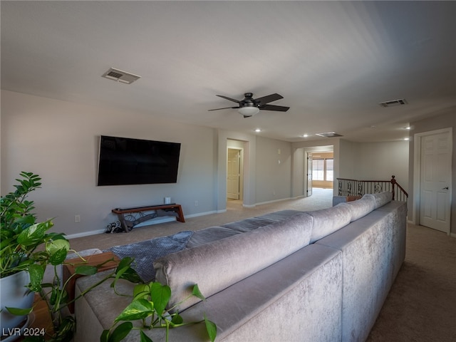 living room with ceiling fan and light carpet