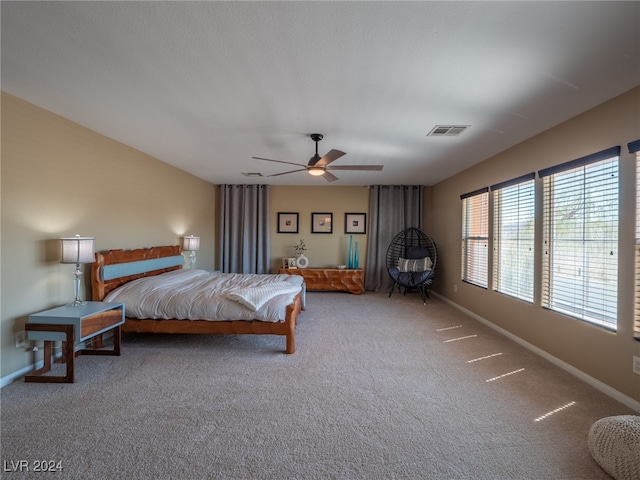 carpeted bedroom with ceiling fan