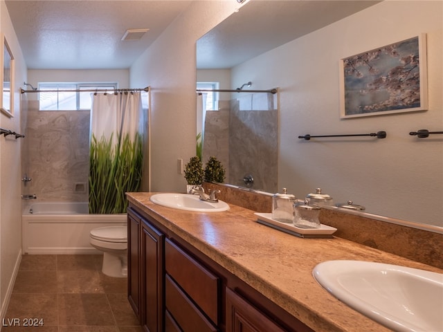 full bathroom with toilet, a healthy amount of sunlight, shower / bathtub combination with curtain, and vanity