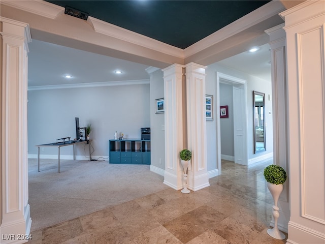 corridor with crown molding, light colored carpet, and ornate columns