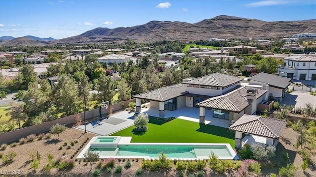 birds eye view of property with a mountain view