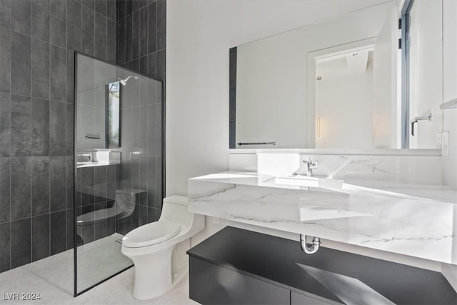 bathroom with tile patterned flooring, vanity, toilet, and a shower with shower door