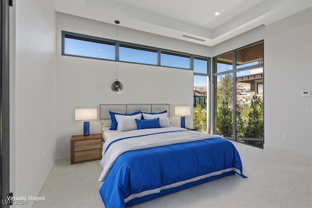 bedroom with visible vents, baseboards, carpet floors, recessed lighting, and a high ceiling