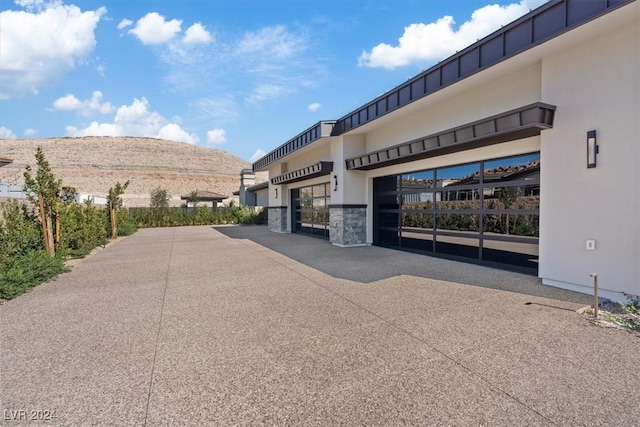 view of building exterior with a mountain view