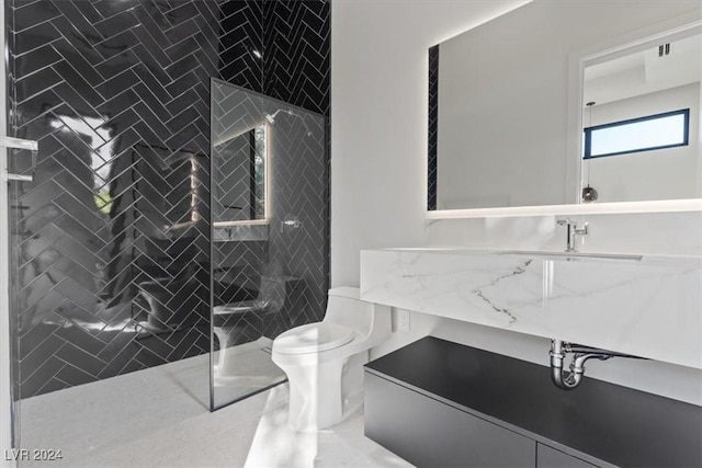 1 Olympia Canyon Way, Las Vegas, NV 89141 - bathroom featuring toilet, a tile shower, and vanity